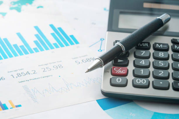 calculator and pencil - tax financial figures analyzing banking document imagens e fotografias de stock