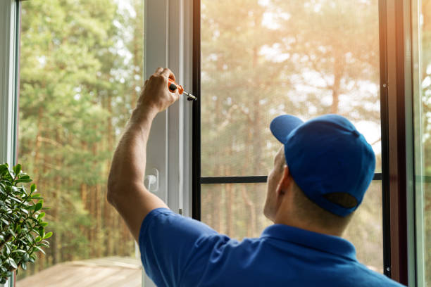 istock man installing mosquito net wire screen on house window 1146028760