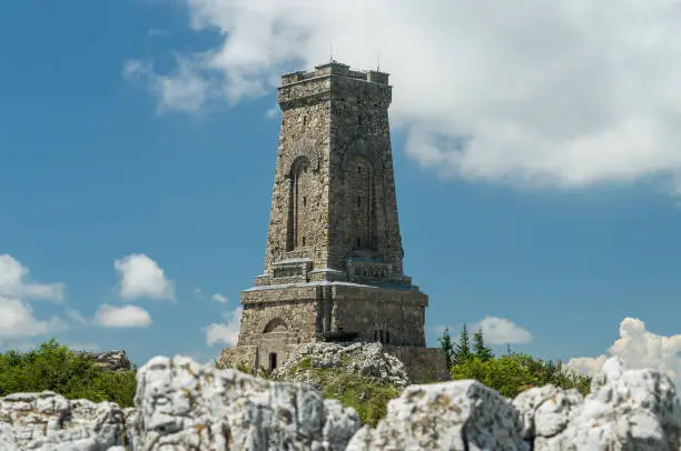 Photo of Monument to Freedom Shipka - Shipka, Gabrovo, Bulgaria. The Shipka Memorial is situated on the peak of Shipka in the Balkan Mountains near Gabrovo, Bulgaria. Summer view against the blue sky.