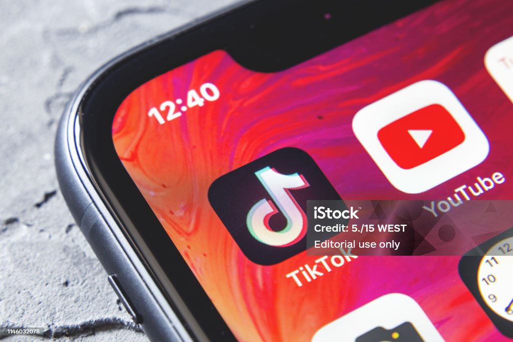 TikTok and YouTube apps on screen iphone xr, close up Tyumen, Russia - April 30,2019: TikTok and YouTube apps on screen iphone xr, close up Mobile App Stock Photo