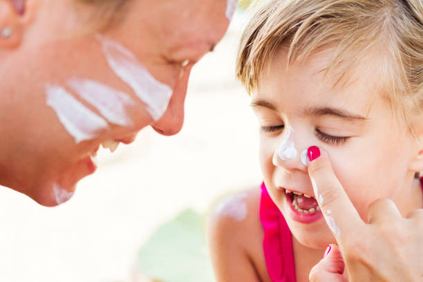 istock Mother applying sunscreen to child's face 1146032310