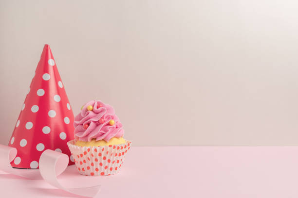 istock Colorful celebration background with various party decoration and cupcake. Minimal party concept. 1146033107