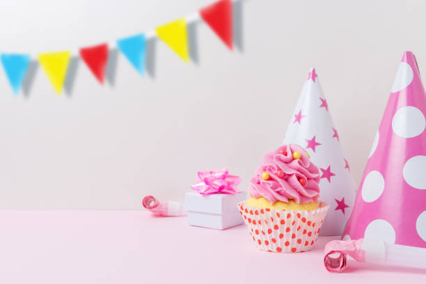 istock Colorful celebration background with various party decoration and cupcake. Minimal party concept. 1146033111