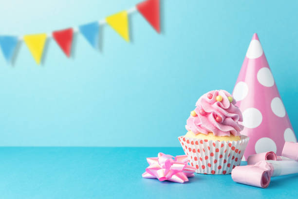 istock Colorful celebration background with various party decoration and cupcake. Minimal party concept. 1146033115