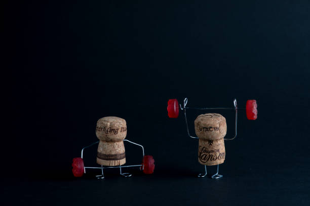 Corks Lifting Jelly Weights Champagne Corks Weight Lifting Jelly Weights in a Clean and Jerk or Snatch and a Deadlift clean and jerk stock pictures, royalty-free photos & images