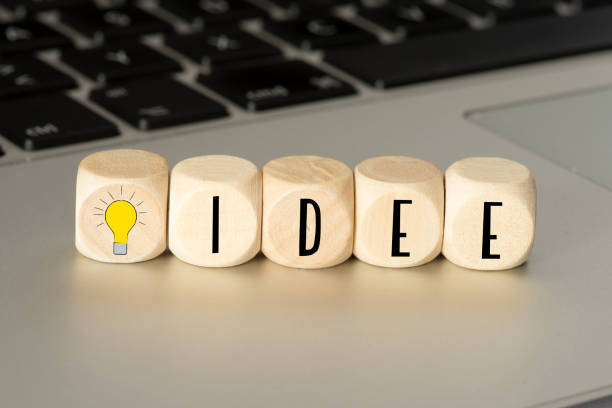 istock A computer and wooden cubes with a light bulb and the word Idea 1146039149