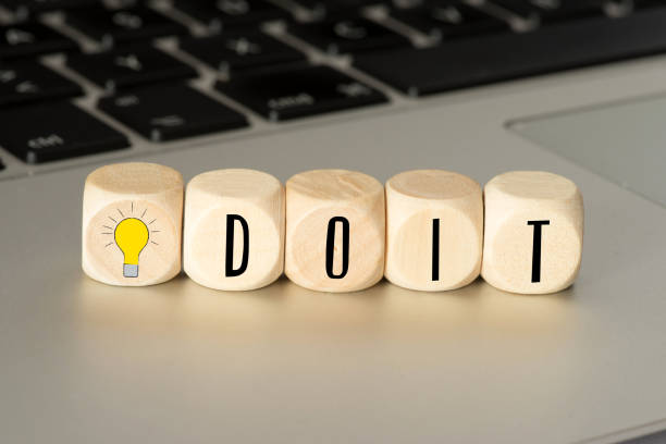 istock A computer and wooden cubes with a light bulb and the slogan Do It 1146039164