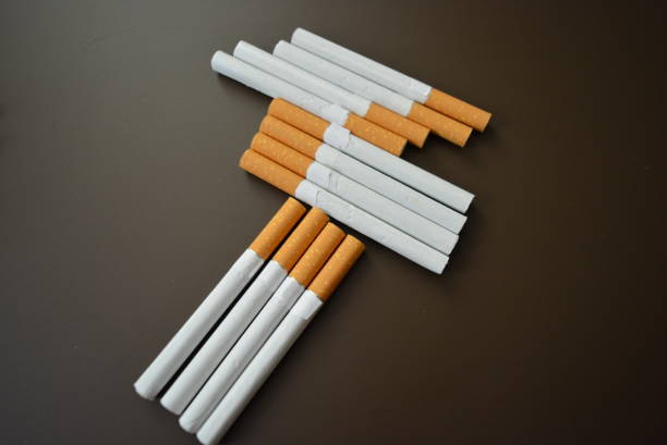 New decomposed many cigarettes on a brown matte background.
