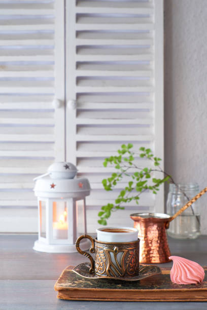 istock Oriental coffee cooked in traditional Turkish copper coffee pot and  served in a matching cup 1146041002