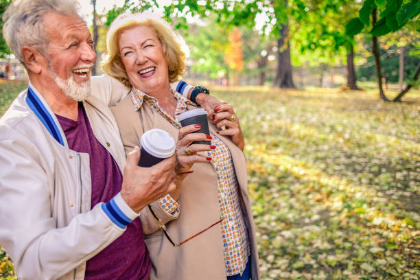 istock cheerful couple having a walk in the park on a nice sunny day 1146041179