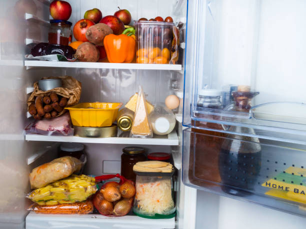 istock open refrigerator filled with food, oil, sauce, diet concept 1146042273