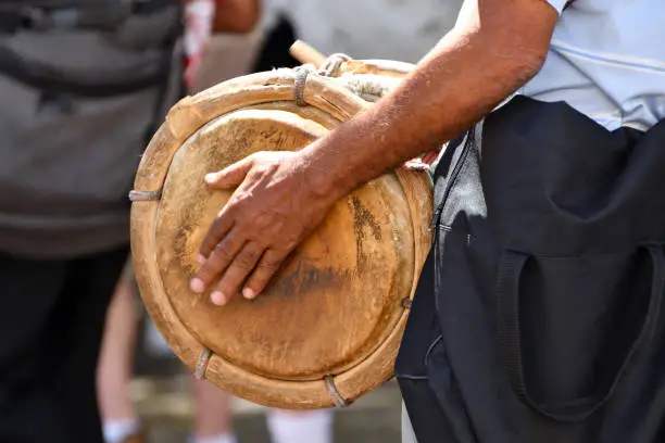 Close Up of a Dominican Man Beating A Drum in a Street in the Dominican Republic