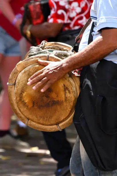 Close Up of a Dominican Man Beating A Drum in a Street in the Dominican Republic