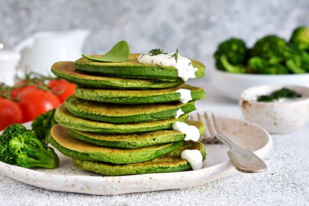 istock Pancakes with broccoli and spinach on the kitchen table. Classic breakfast. 1146044203