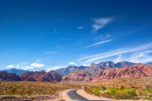 Photo of a road at Red Rock Canyon, Nevada. Dramatic sky