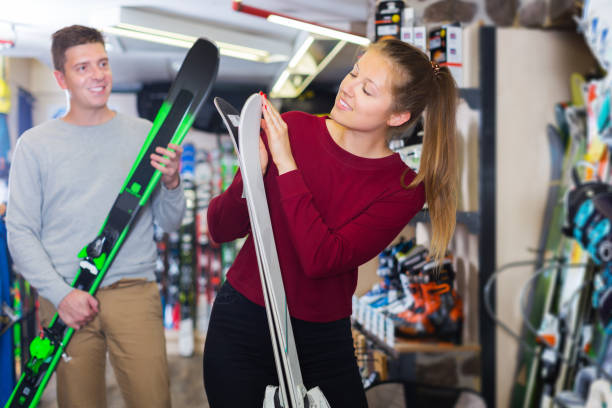 istock Woman with man are choosing ski 1146048529