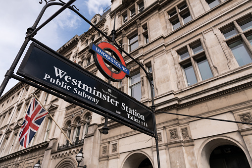 London, UK - Mar 17, 2019: Westminster station sign late in the day.