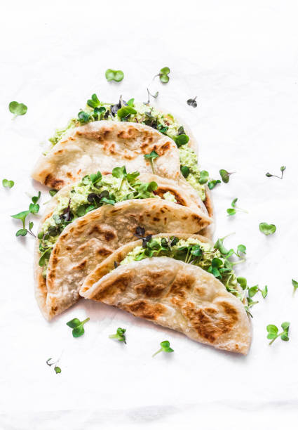 istock Avocado micro greens quesadilla on a light background, top view 1146051134
