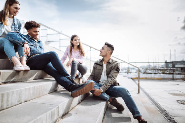 istock friends talking together in the steps 1146052575