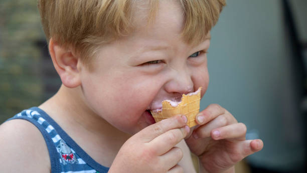 istock Baby boy enjoys a delicious ice cream in spring 1146057692
