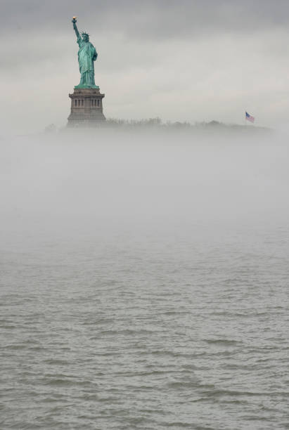 istock Statue of Liberty over the mist 1146058300