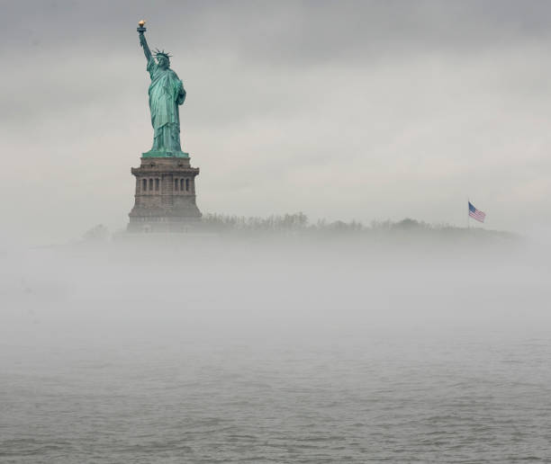 istock Statue of Liberty Rises above the mist 2 1146058302