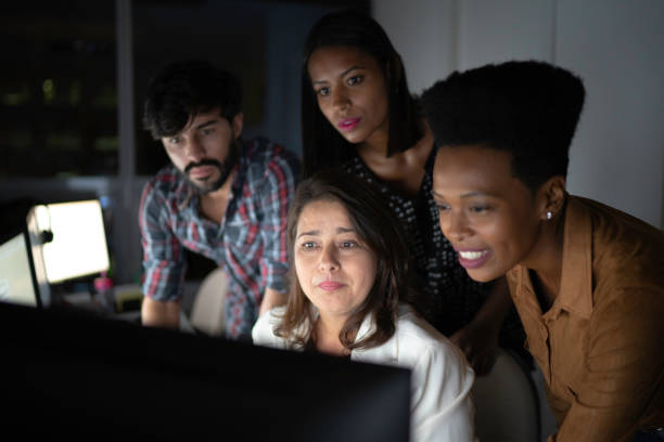 istock Dedicated team reunited working late at office 1146058434