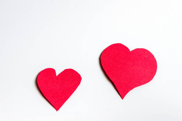 istock Handmade red paper hearts against a white background 1146058910