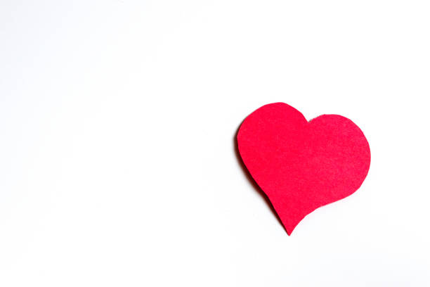 istock Handmade red paper heart against a white background 1146058936