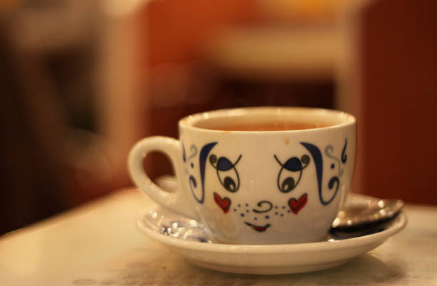 Cup of tea or coffee on a plain background