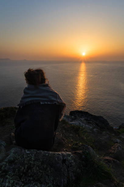 istock People enjoying a beautiful sunset on the cost 1146062180