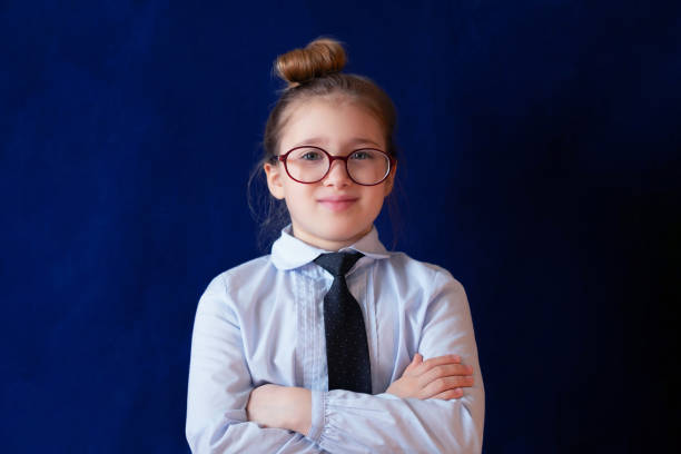 istock Diligent school student standing with crossed arms 1146068426