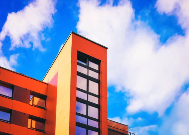 istock Part of modern apartment house copy space blue sky clouds 1146068537