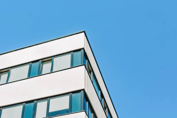 istock Modern corporate business office building skyscraper blue sky 1146070102