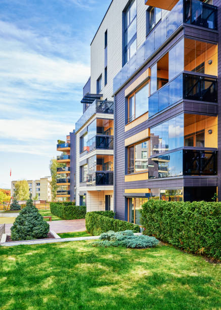 Modern complex of apartment residential Modern complex of apartment residential buildings with green trees and outdoor facilities. architectural stele stock pictures, royalty-free photos & images
