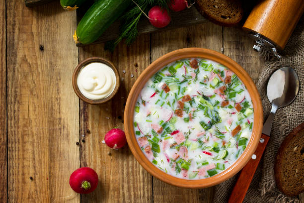 istock Delicious summer lunch. Spring-summer yoghurt cold soup  fresh vegetables and kefir on rustic wooden table. Copy space, top view flat lay background. 1146072099