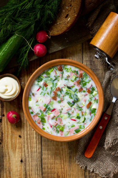 istock Delicious summer lunch. Spring-summer yoghurt cold soup  fresh vegetables and kefir on rustic wooden table. Copy space, top view flat lay background. 1146072108