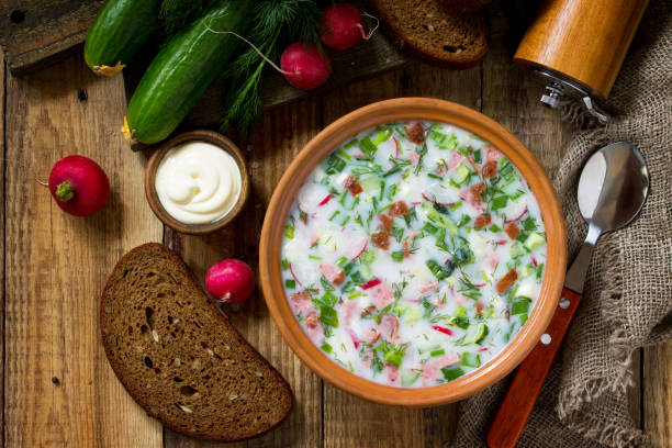 istock Delicious summer lunch. Spring-summer yoghurt cold soup  fresh vegetables and kefir on rustic wooden table. Top view flat lay background. 1146072109