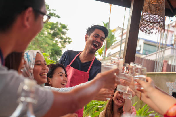istock A Group of Young Adults At the Dining Table Having a Good Time 1146074770