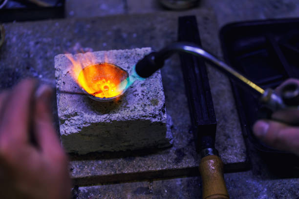 istock Jeweler melts gold in a crucible. Workshop workflow 1146074814