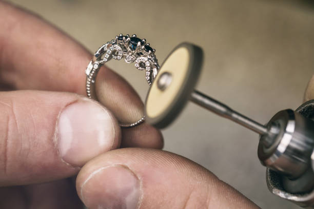 istock Jeweler polishes a gold ring in the workshop. Close-up workflow 1146074820