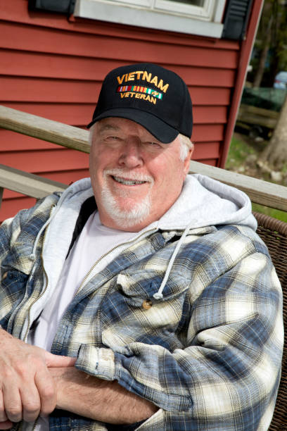 istock Vietnam Veteran sitting in back yard looking at camera 1146074855