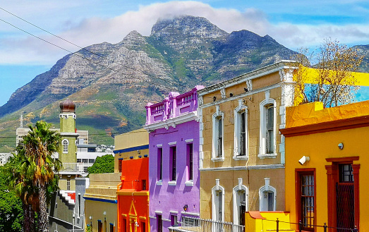 Cape town Bo Kaap Malay quarter rooftops with table mountain in the background, featuring the typical colorful houses.