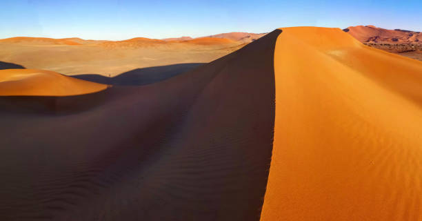 istock Red dunes aerial panoramic view in Namib desert Sossusvlei area 1146075921