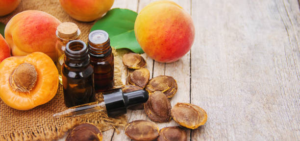 istock apricot oil in a small jar. selective focus. 1146077179