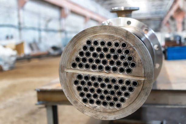 Manufacture of a new heat exchanger with tube bundle Manufacture of a new heat exchanger with a carbon steel tube bundle flange stock pictures, royalty-free photos & images