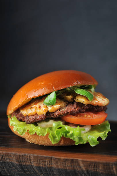 istock hamburger with cutlet, tomato and pineapple 1146081457