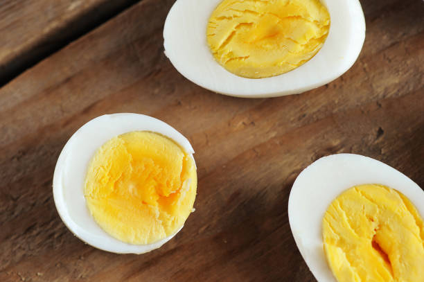 istock halves of boiled eggs on a wooden rustic background 1146081573