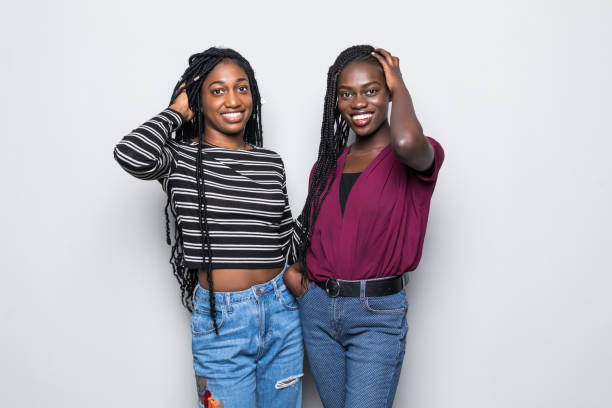 istock Two african woman standing on white background 1146083213