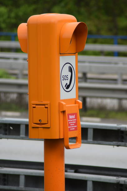 istock orange emergency phone column on Autobahn 1146086175